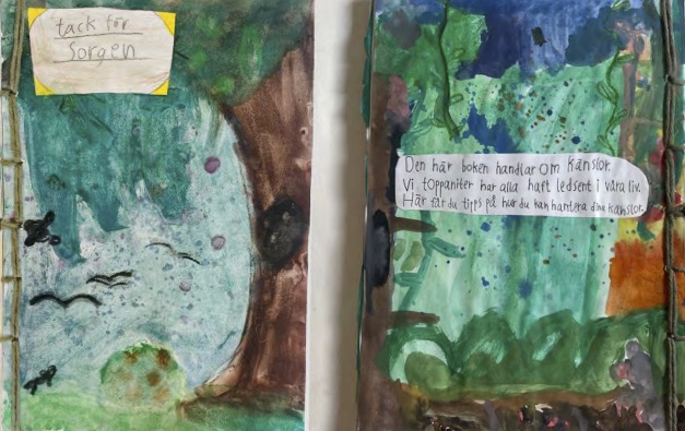 Pärmen till Topeliusskolans bidrag föreställer en mörk skog målad med vattenfärger